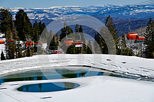 Orange bubble chair lift at Park City Canyons Ski Area in Utah.