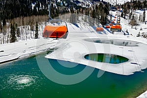 Orange bubble chair lift at Park City Canyons Ski Area in Utah.