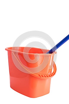 Orange bucket and mop for cleaning indoors isolated on white
