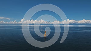 Orange buoy in the sea.