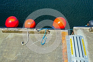 Orange buoys on a dock in Prince Rupert, British Columbia, Canada