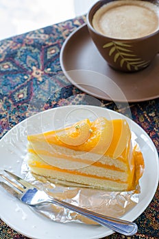 Orange cake and late coffee cup