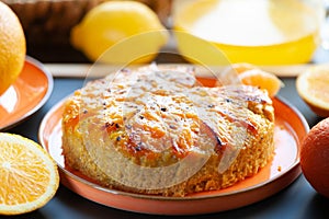 Orange cake or pie. Cozy home baking concept. Still life with delicious pie, tea surrounded by citrus fruits