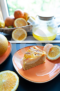 Orange cake or pie. Cozy home baking concept. Still life with delicious pie, tea surrounded by citrus fruits
