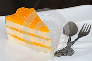 Orange cake on white dish