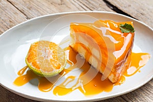 Orange cake on wood background