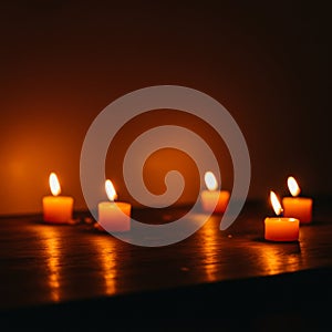 Orange Candles Glow in Dark on Wooden Table