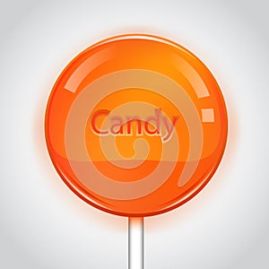 Orange candy on white background. Lollipop