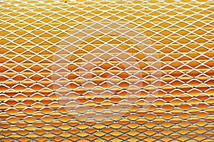 Orange car filter background with iron grille close-up