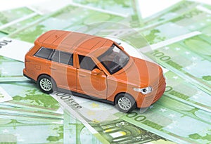 orange car and money