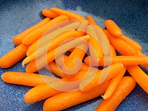 Orange carrots in blue bowl