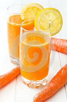 Orange and carrots juice in a glass