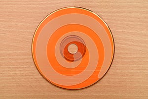 Orange CD or DVD on the table