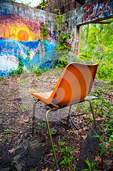 Orange chair in abandoned building