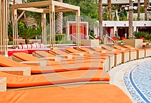 Orange Chaise Lounges at a Resort Patio