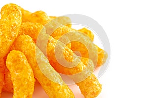 Orange Cheddar Cheese Puffs on a White Background