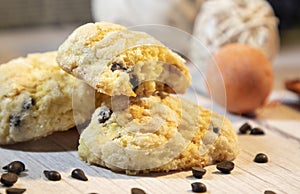 Orange chip cookies with chocolate drops on the wooden table