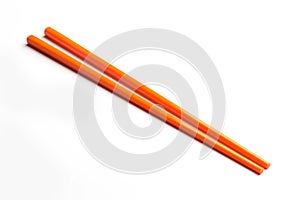 Orange chopsticks isolated on white