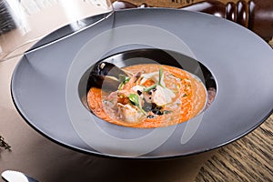 Orange chowder soup with shrimps