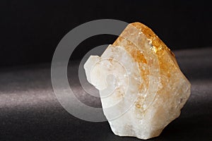 Orange citrine crystal mineral on black background