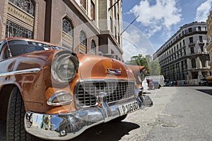 Orange classic car in Old Havana, Cuba