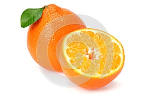 Orange clementine or minneola tangelo with slices and green leaves isolated on white background. Tangerine. Citrus fruit