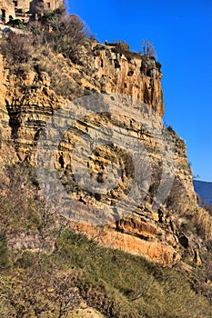 Orange cliffs in stratified subaqueous tuff deposits