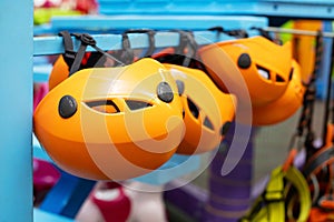 Orange Climbing Helmets on Display