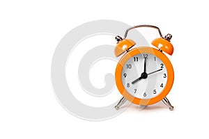 Orange The clock sets the time to 8.00. on white background isolate