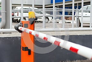 Orange closed parking barrier for cars