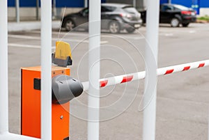 Orange closed parking barrier for cars