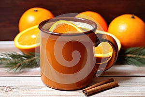 orange and clove spiced cider in ceramic mug