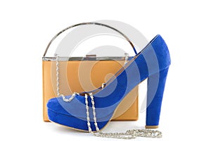 Orange clutch and blue high heels photo