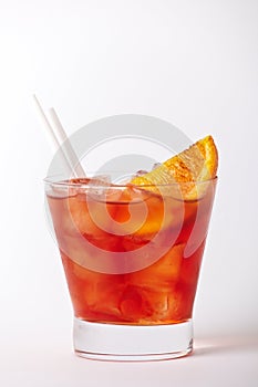 Orange cocktail drink with lemon and cherry