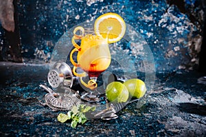 Orange cocktail with lime and vodka. Beverage alcoholic drink with lime, lemons and ice served cold at restaurant