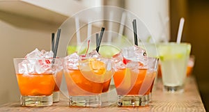 Orange cocktails on a counter at a corporate event