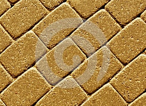 Orange color cobblestone pavement surface.