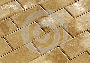 Orange color cobblestone pavement texture.