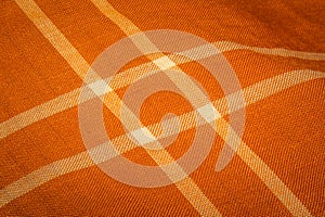 Orange color Kain Pelikat or Kain Sarong with stripe forming a square.