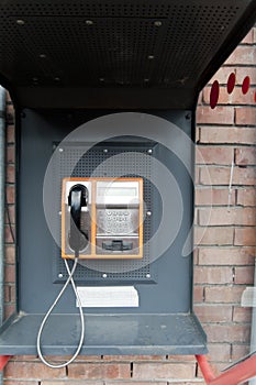 Orange Color Payphone using by call in bulgaria