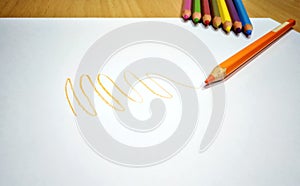 Orange Color Pencil Scribble on a Clean White Paper