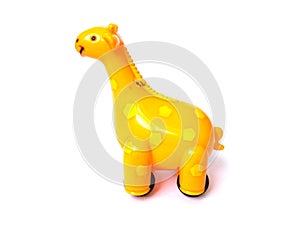 Orange color plastic giraffe toy.