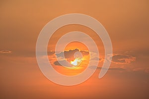 Orange color sky with cloud and sun background