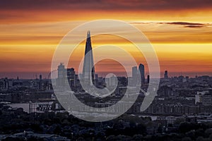 Orange colored dusk view of the unique skyline of London