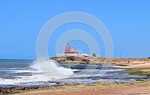 Orange Colored Hindu Temple at Coastal Beach with High Rising Ocean Waves - Arabian Sea, Chorwad, Gujarat, India