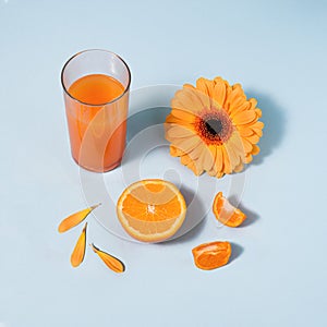 Orange colored summer items against blue background