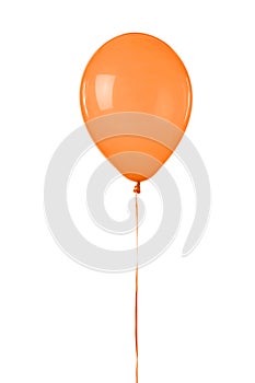 An orange colored toy balloon