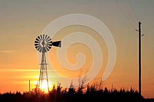 Orange colorful Sunset with a Windmill silhouette