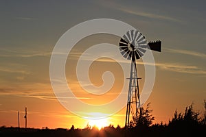 Orange colorful Sunset with a Windmill silhouette