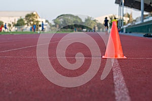 Orange cone on racetrack used in practice run